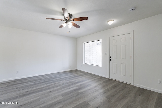 foyer with dark hardwood / wood-style floors and ceiling fan