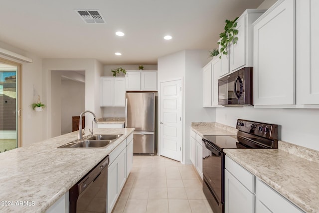 7790 W Noble Prairie Way, Florence, AZ 85132 - kitchen featuring recessed lighting, light countertops, visible vents, a sink, and black appliances