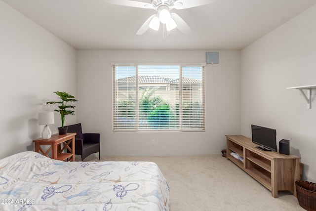 bedroom with ceiling fan and light colored carpet