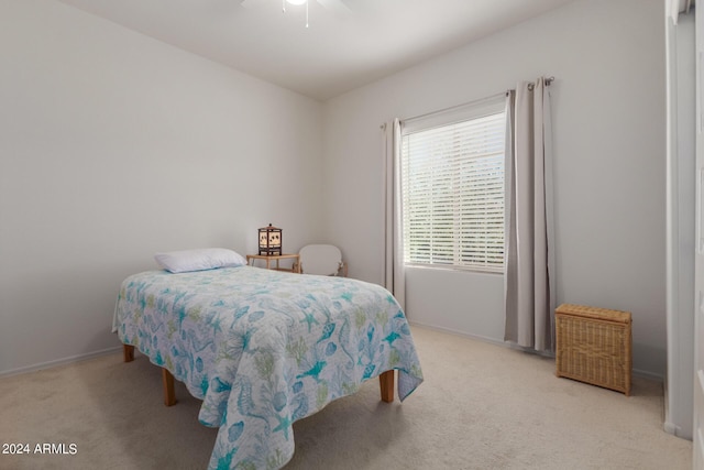 7790 W Noble Prairie Way, Florence, AZ 85132 - bedroom with baseboards, light colored carpet, and ceiling fan