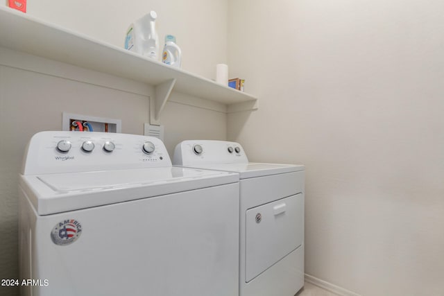 washroom featuring washing machine and dryer