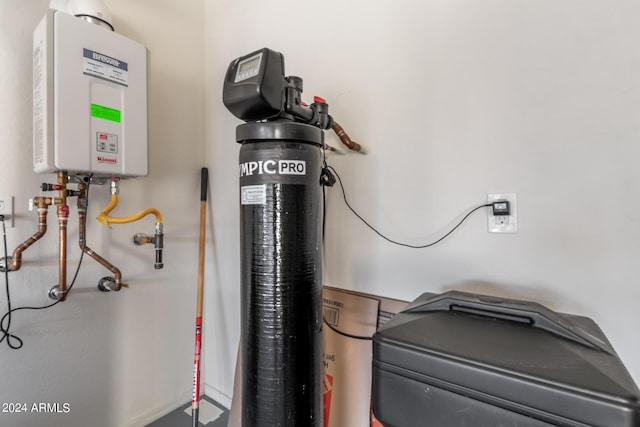 utility room featuring tankless water heater