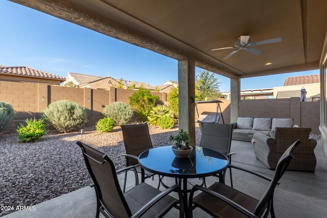 7790 W Noble Prairie Way, Florence, AZ 85132 - view of patio / terrace with outdoor dining area, a fenced backyard, ceiling fan, and an outdoor living space