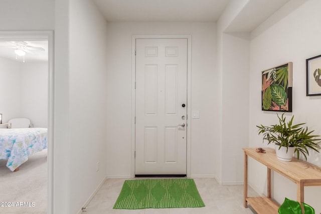 interior space with ceiling fan