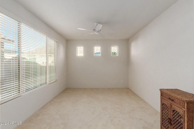 carpeted empty room with ceiling fan