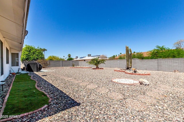 view of yard with a fenced backyard