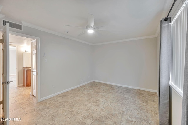 empty room with ceiling fan and crown molding