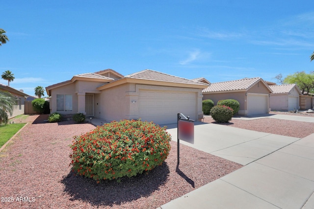 11207 W Turney Ave, Phoenix, AZ 85037 - single story home featuring a garage, driveway, stucco siding, and a tile roof