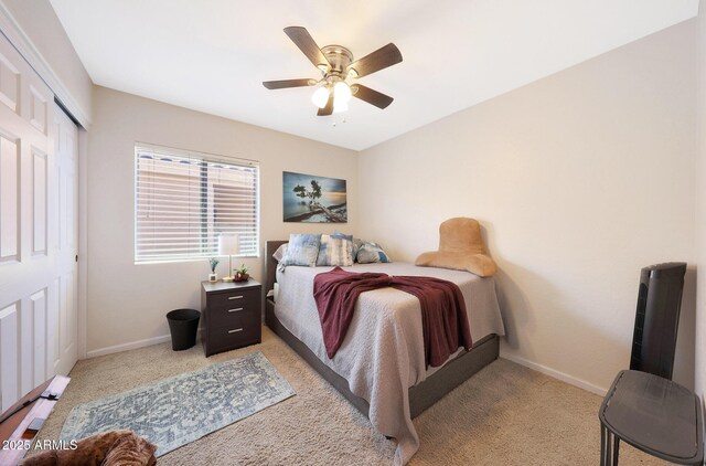 11207 W Turney Ave, Phoenix, AZ 85037 - bedroom featuring light colored carpet, baseboards, a closet, and ceiling fan