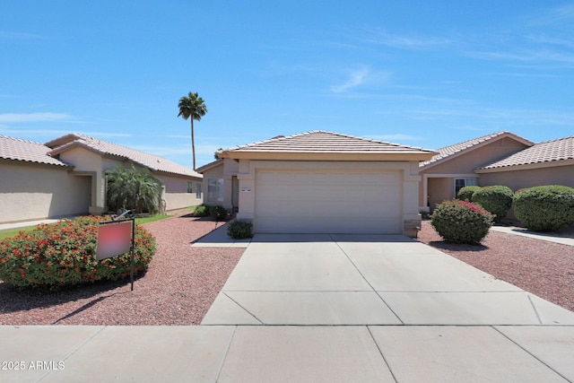 11207 W Turney Ave, Phoenix, AZ 85037 - single story home with a garage, driveway, stucco siding, and a tile roof