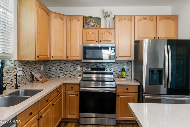 1812 E Parkside Ln E, Phoenix, AZ 85024 - kitchen with appliances with stainless steel finishes, decorative backsplash, light stone countertops, and light brown cabinetry