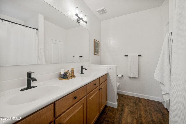 1812 E Parkside Ln E, Phoenix, AZ 85024 - full bathroom featuring wood finished floors and double vanity