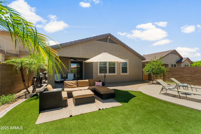 1812 E Parkside Ln E, Phoenix, AZ 85024 - back of property with a ceiling fan, a fenced backyard, outdoor lounge area, a patio area, and stucco siding