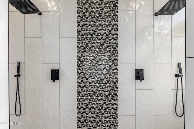bathroom with tiled shower