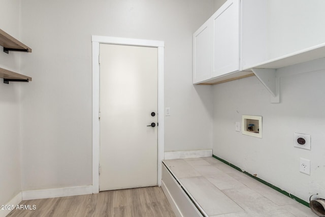 washroom with cabinet space, baseboards, light wood-style floors, washer hookup, and electric dryer hookup