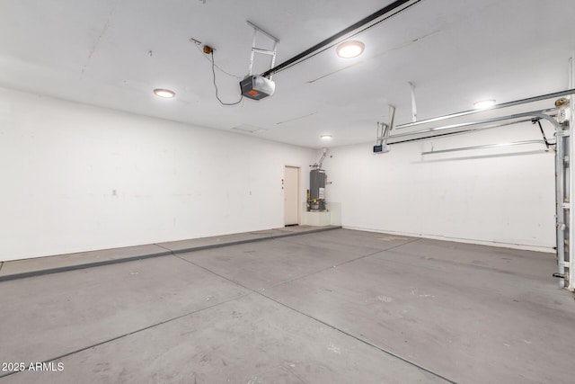 garage with water heater and a garage door opener