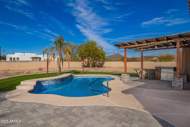 view of pool with a fenced backyard, a grill, exterior kitchen, a pergola, and a patio area
