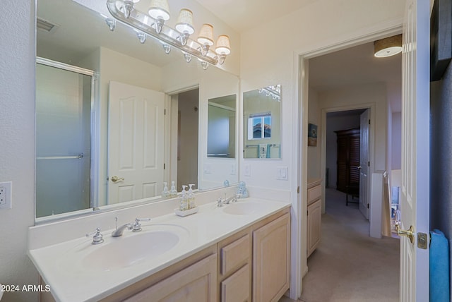 bathroom with vanity and an enclosed shower