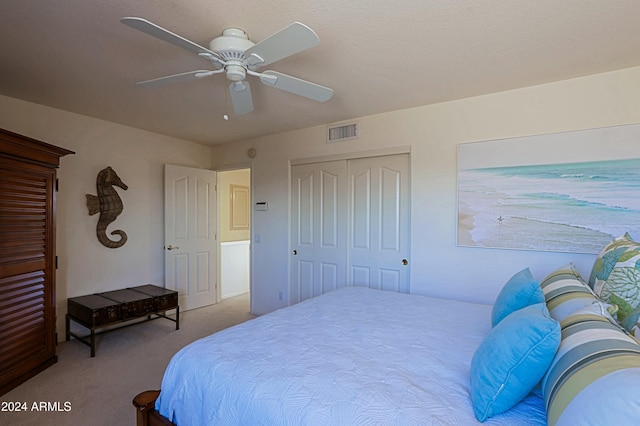 bedroom featuring carpet flooring, ceiling fan, and a closet