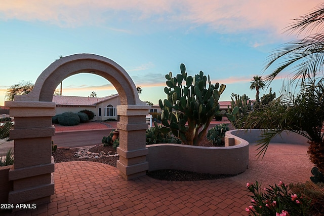 view of patio terrace at dusk