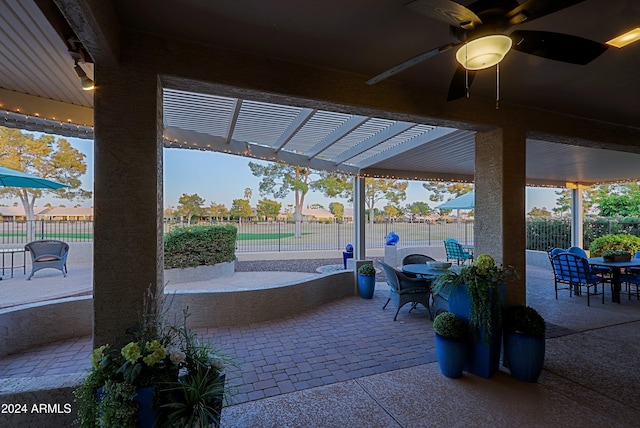 view of patio / terrace featuring a pergola and ceiling fan