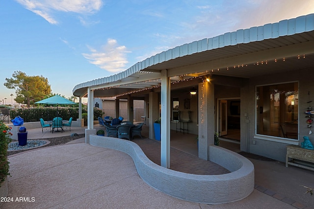 view of patio terrace at dusk