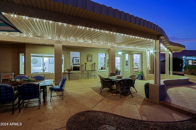 view of patio terrace at dusk