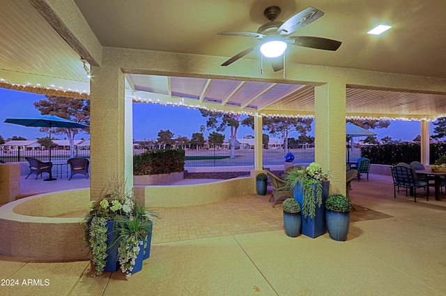 patio terrace at dusk with ceiling fan