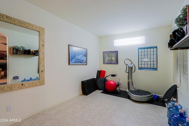 workout room featuring light tile patterned flooring