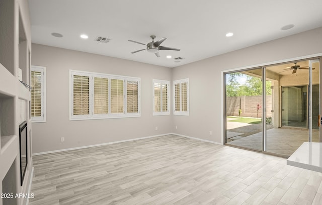 unfurnished living room featuring ceiling fan, light wood-type flooring, recessed lighting, and baseboards