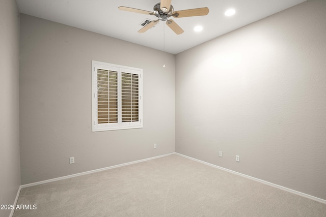 carpeted spare room featuring ceiling fan, baseboards, and recessed lighting