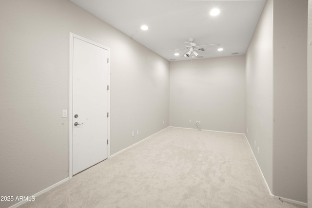 empty room featuring a ceiling fan, recessed lighting, carpet floors, and baseboards