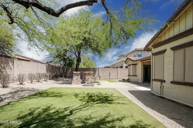 fenced backyard featuring a patio
