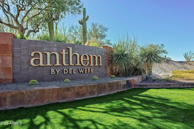 community / neighborhood sign featuring a lawn