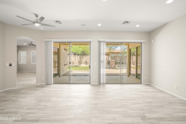 empty room featuring ceiling fan, wood finished floors, baseboards, and recessed lighting
