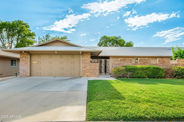 ranch-style home featuring a garage and a front lawn