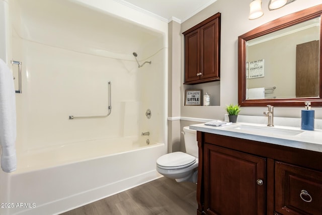 full bathroom featuring toilet, crown molding, shower / tub combination, vanity, and hardwood / wood-style floors