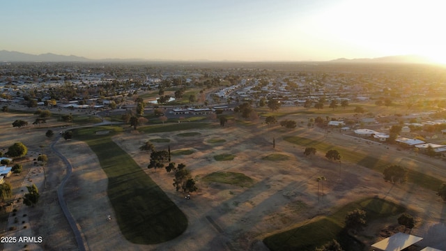 aerial view at dusk featuring a mountain view