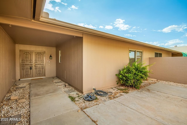 property entrance with a patio area