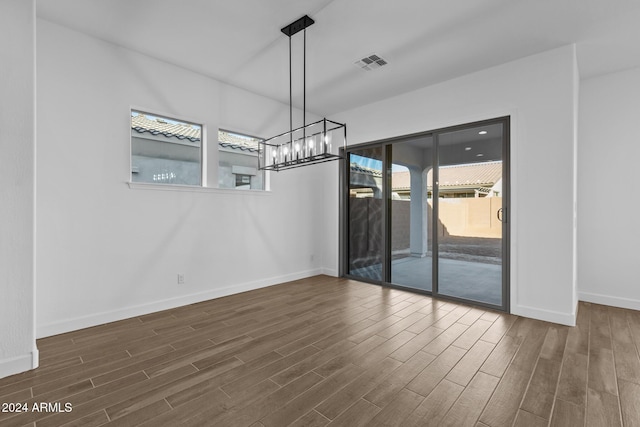 unfurnished dining area with dark hardwood / wood-style floors