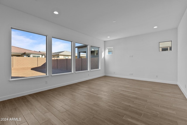 unfurnished room with light hardwood / wood-style floors