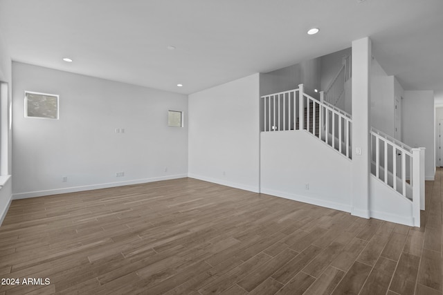 unfurnished living room featuring wood-type flooring