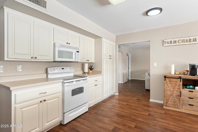 kitchen featuring white cabinetry, white appliances, and dark hardwood / wood-style floors