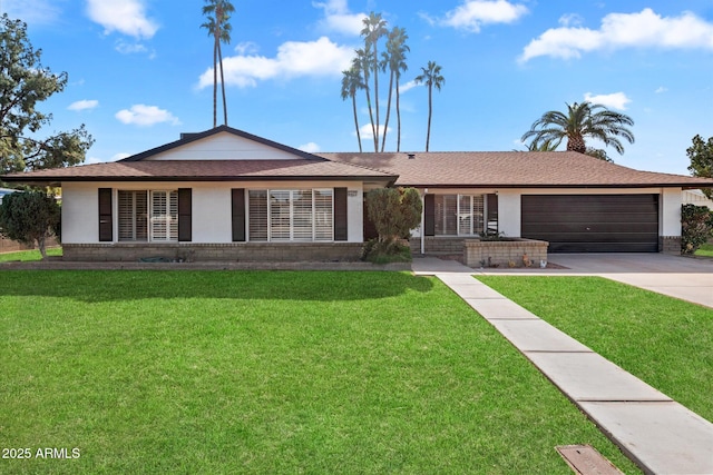 ranch-style home with a garage and a front lawn