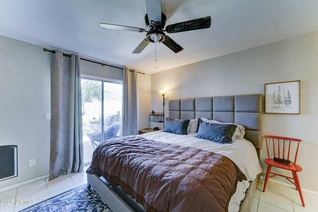 bedroom featuring access to outside, baseboards, ceiling fan, and light tile patterned floors