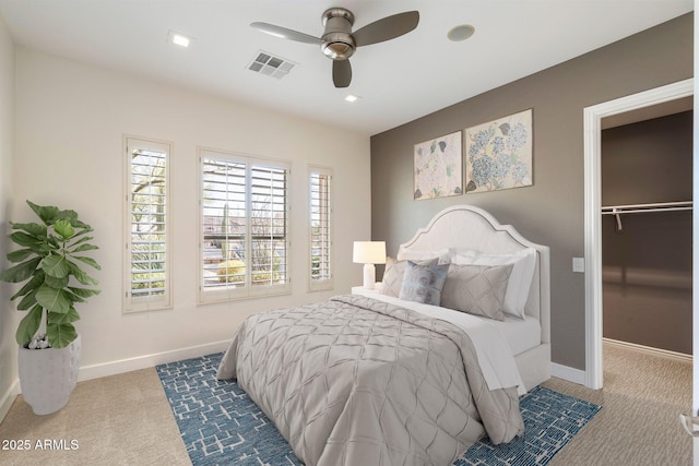 bedroom with a ceiling fan, carpet, visible vents, and baseboards