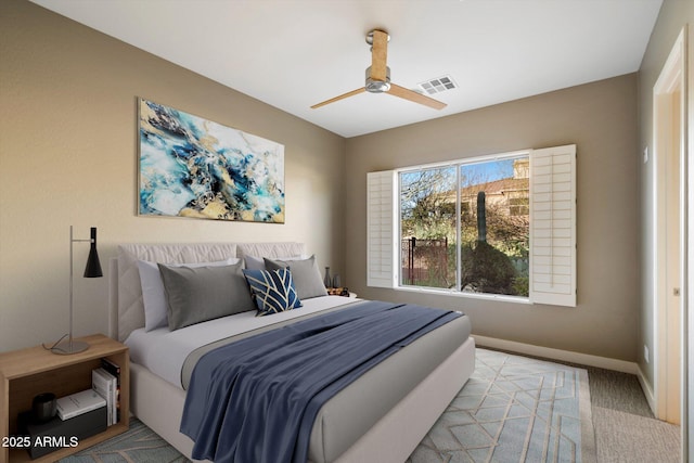 bedroom with light carpet, visible vents, ceiling fan, and baseboards