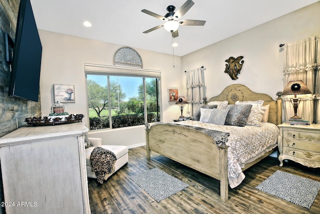 bedroom featuring dark wood-type flooring and ceiling fan