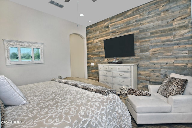 bedroom with wooden walls