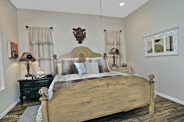 bedroom featuring dark hardwood / wood-style floors